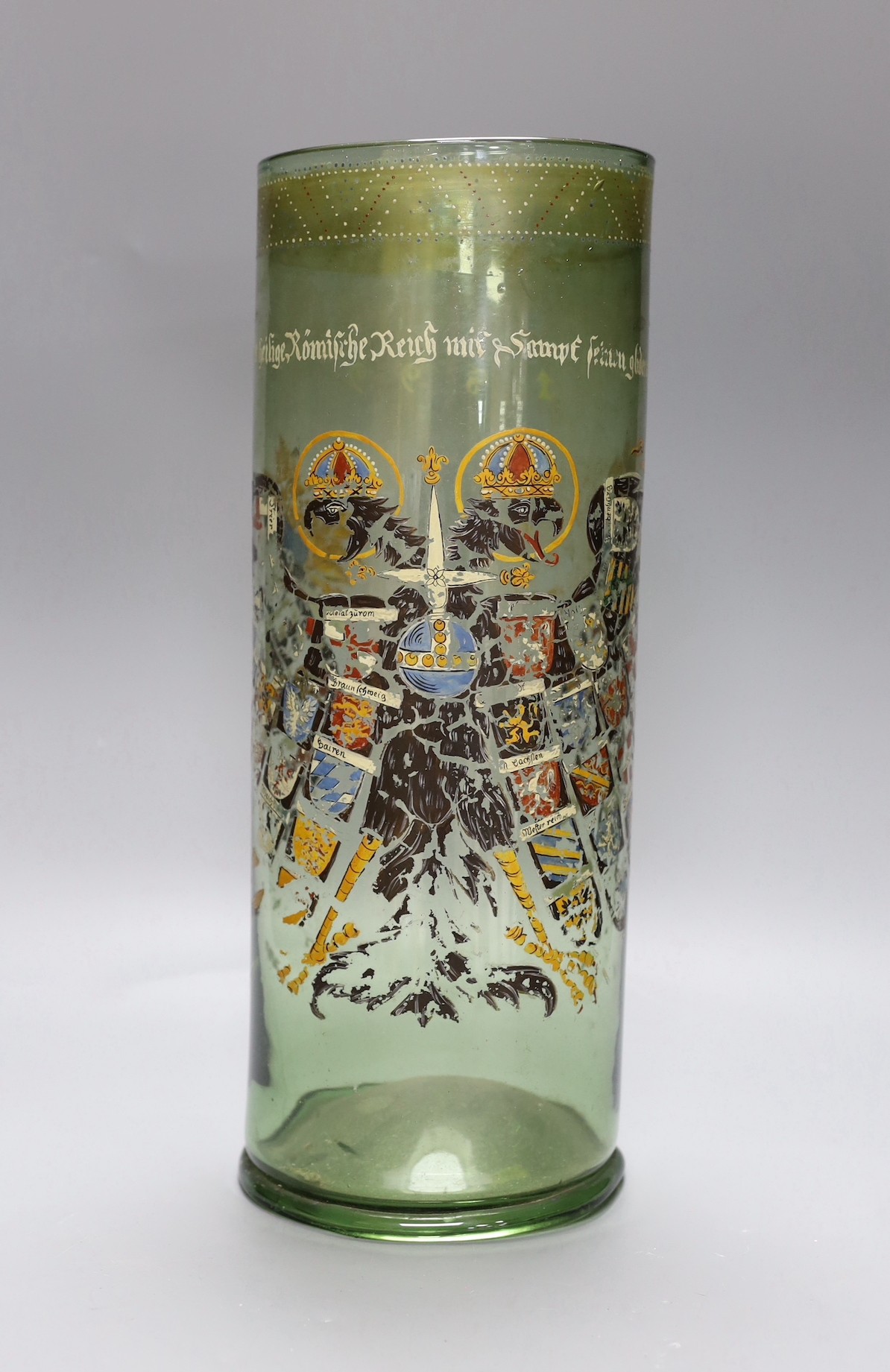 A German glass Humpen with collector's labels on base, painting a little worn, circa 18th century, 39 cms high